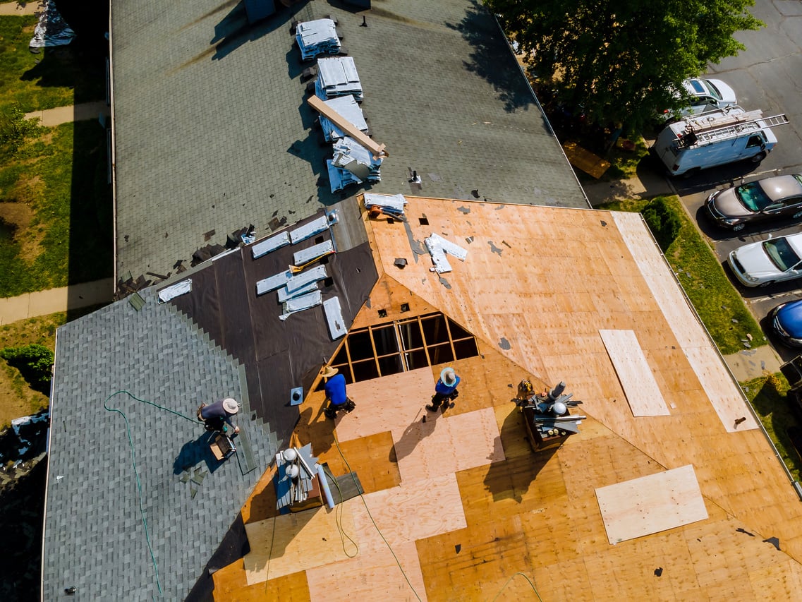 Removal of Old Roof and Replacement Roofs with New Roof Shingle Being Applied Home Roof Construction All New Materials.